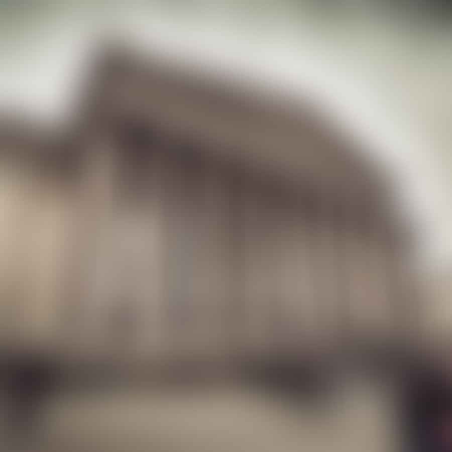 The impressive facade of the British Museum, with visitors entering the building