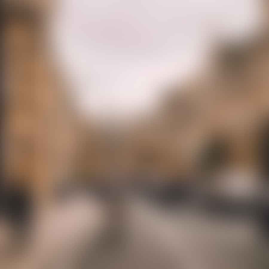 A bustling street in Oxford with cyclists and pedestrians